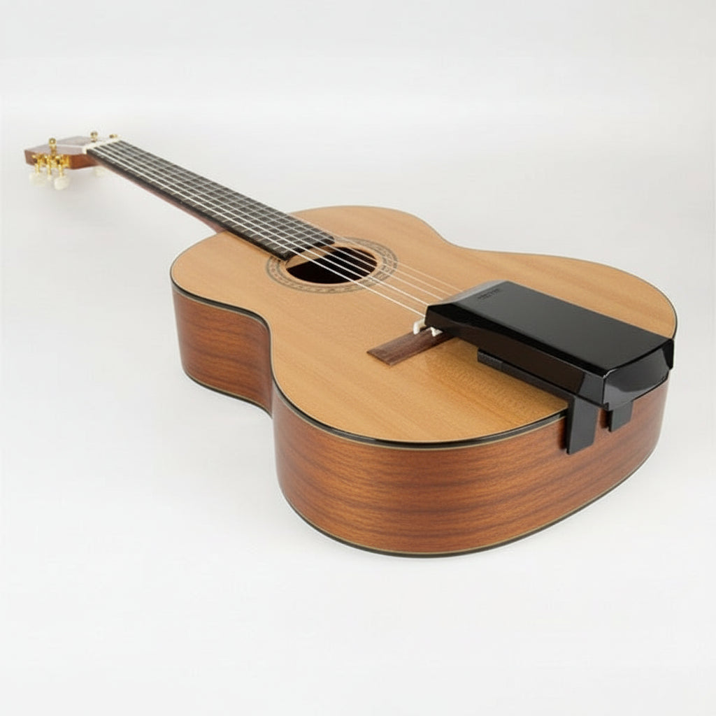 Acoustic guitar with a digital audio interface on a white background